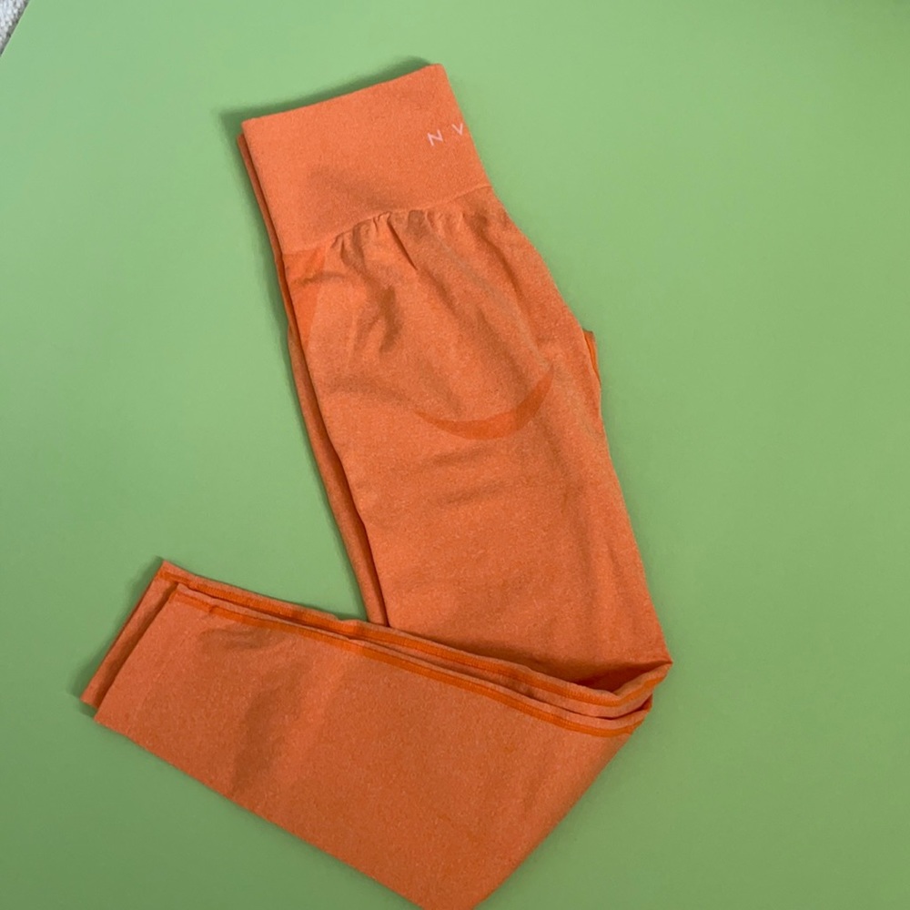 orange nvgtn curve leggings